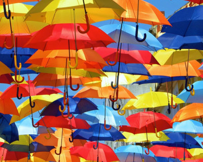 Colorful Umbrellas Floating in the Streets in Portugal