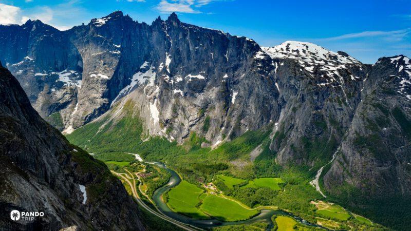 Troll Wall above Romsdalen Valley with the Rauma river and late-spring snow, Norway