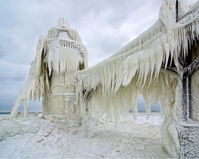 Frozen St. Joseph North Pier on Lake Michigan, USA