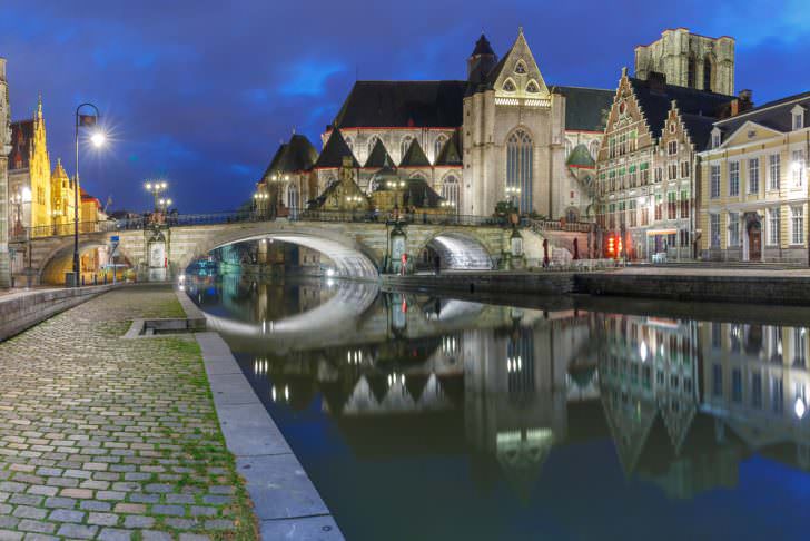 St Michael's Bridge and church at night in Ghent, Belgium