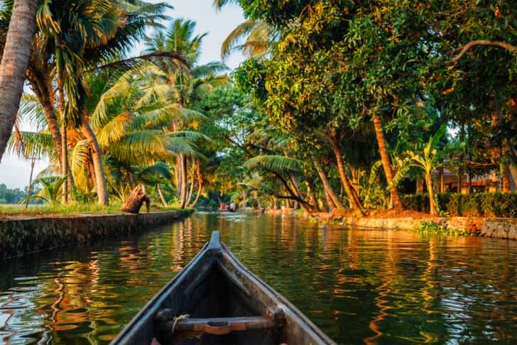 Kerala backwaters tourism travel in canoe boat, India