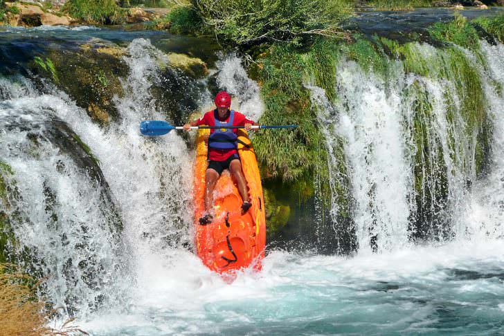 Croatia kayaker over a waterfall