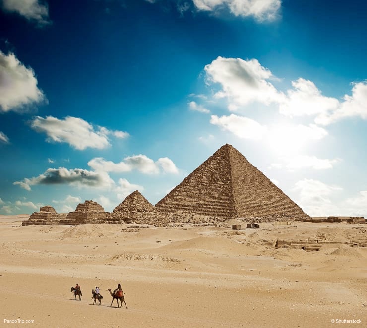 Bedouins on camels near the Pyramids of Giza