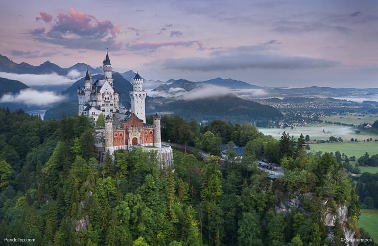 Neuschwanstein Castle during foggy summer morning