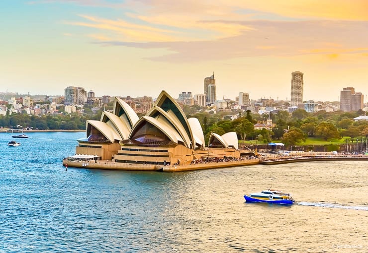 View of the Sydney Harbour with some ferries passing by Sydney Opera House