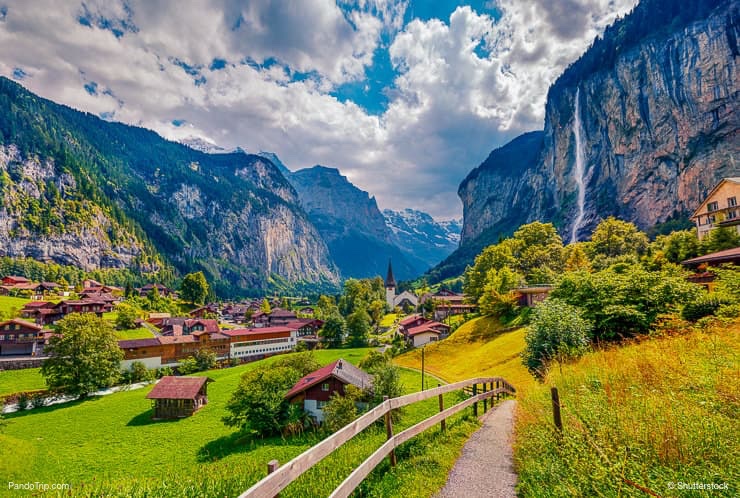 Sunny view of Staubbach waterfall in Lauterbrunnen village