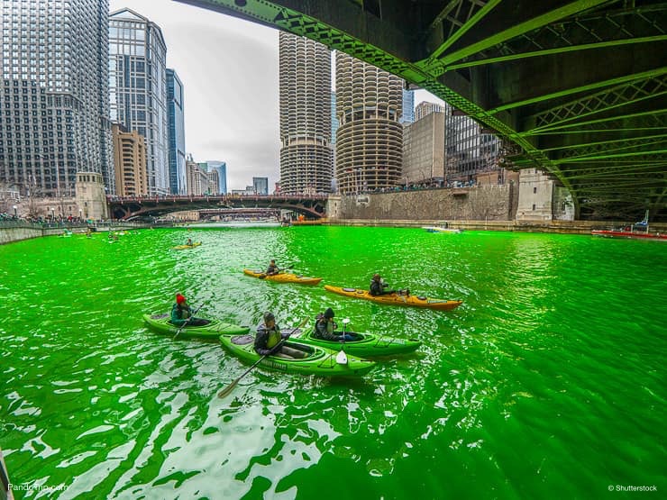 Kayaks and dyed green river in downtown Chicago during the St. Patricks Day celebration