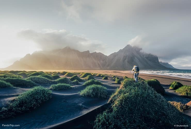 Photographer taking photo of famous Vestrahorn Mountain