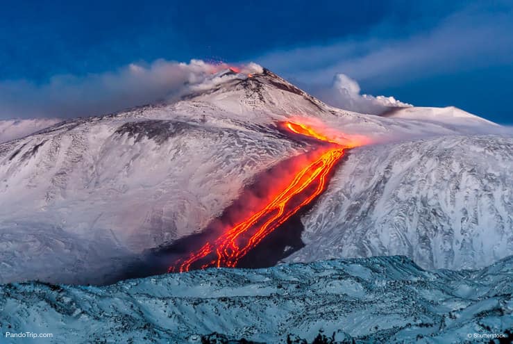 Etna Eruption. Lava flow through the snow. Sicily, Italy