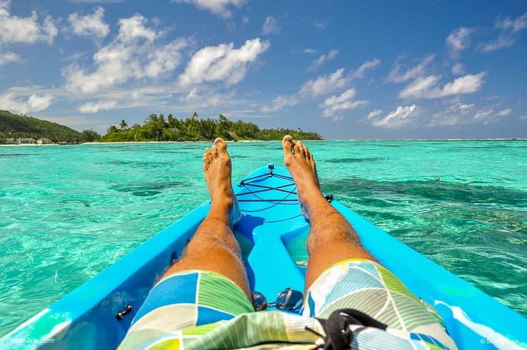 Kayaking near Motu Koromiri, a small island in the lagoon of Rarotonga near Muri Beach. Cook Islands