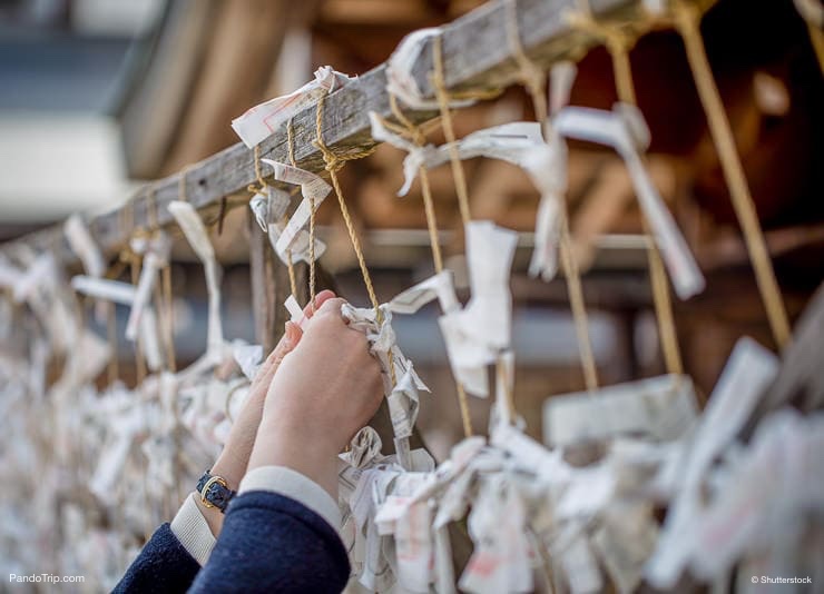 Omikuji fortune telling paper strip. People leave the omikuji behind if it's not a good one