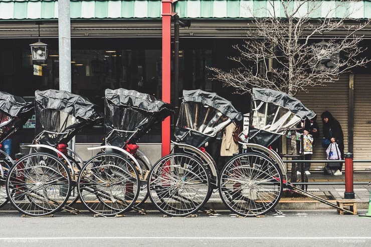 Row of Japanese rickshaws parking at the sidewalk on Asakusa road