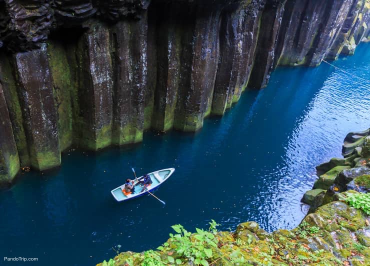 People in a rowing boat. Takachiho Gorge, Japan