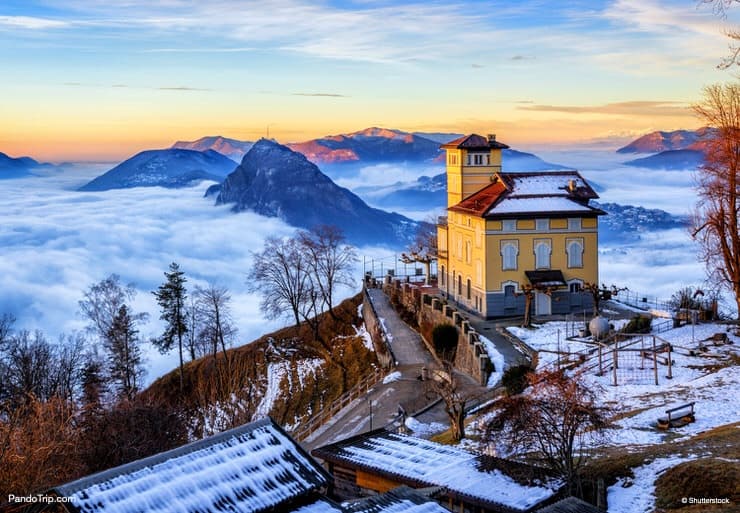 Panoramic view of Lugano city, Lake Lugano and Monte San Salvatore in winter