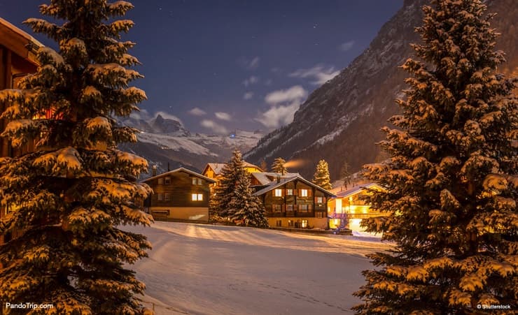 Winter night over Tasch valley, the gate to Zermatt, Switzerland