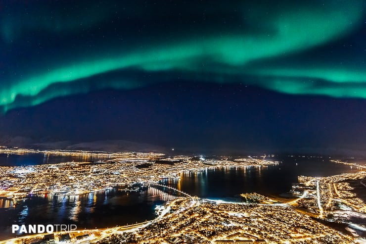 Aurora Borealis over Tromso. View from Mount Storsteinen