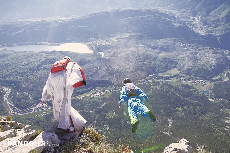 Base jumping off cliff from Monte Brento exit