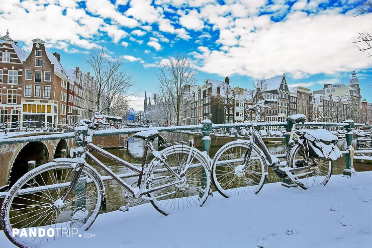 Bicycles covered in snow in Amsterdam