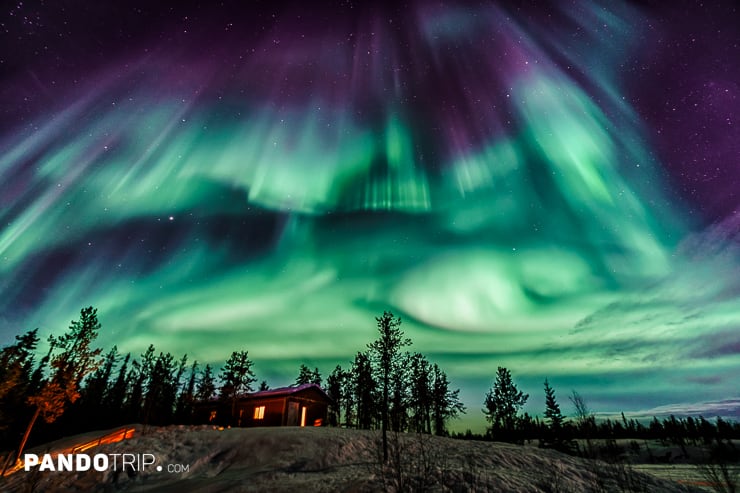 Northen Lights over chalet in Yellowknife