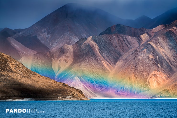 Faded rainbow peeking over Pangong Tso lake