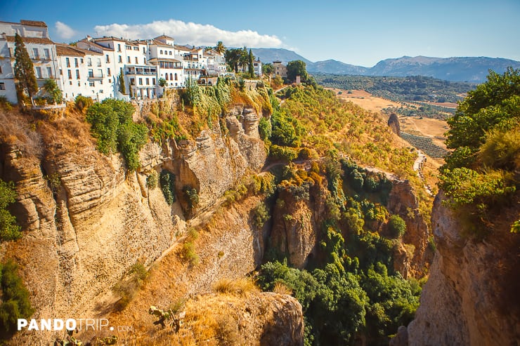A cliffside town of Ronda with buildings overlooking a deep gorge