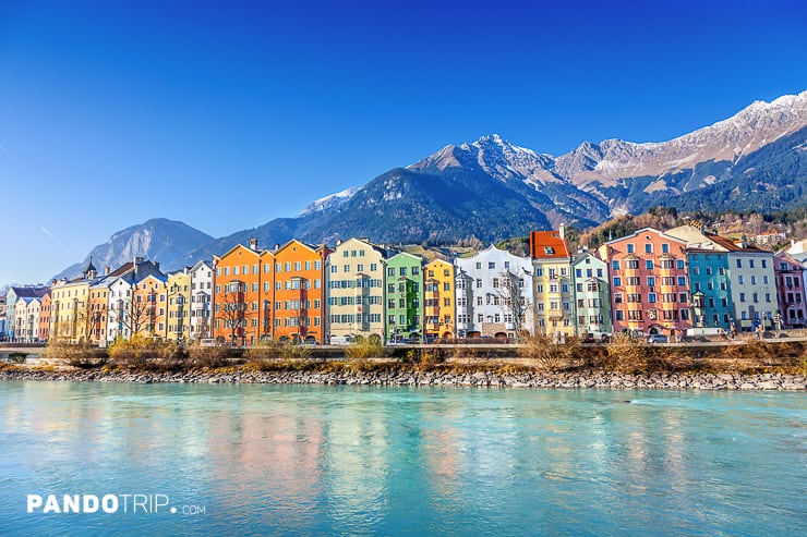 Colorful houses of Innsbruck with mountains in the backround