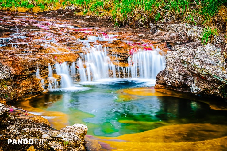 Small waterfall flowing over rocks, Cano Cristales