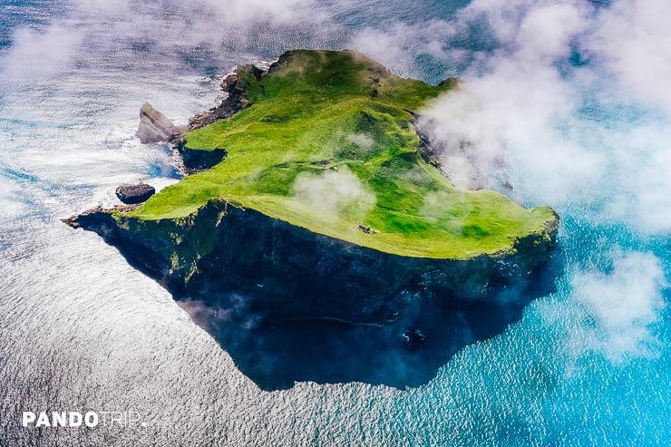 Aerial view of Ellidaey Island with a lonely house