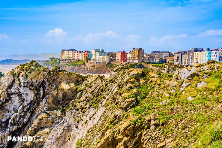 Colorful houses behind cliffs in Tenby a harbour town in Pembrokeshire, Wales