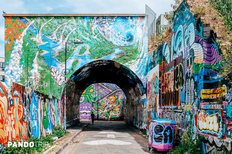 Pedestrian Alleyway covered in graffiti line near Brick Lane, London