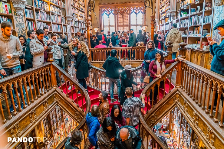 Hundreds of tourists crowd the iconic Livraria Lello bookstore in Porto