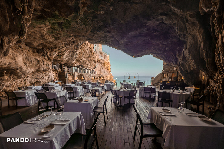 Interior view of Grotta Palazzese, an Italian restaurant in a cave