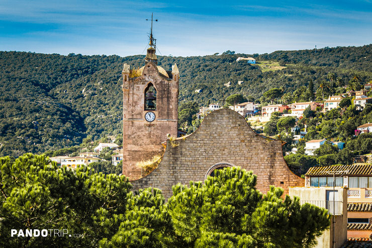 Close-up view of the Church of Sant Martí in Calonge with its distinctive Gothic bell tower