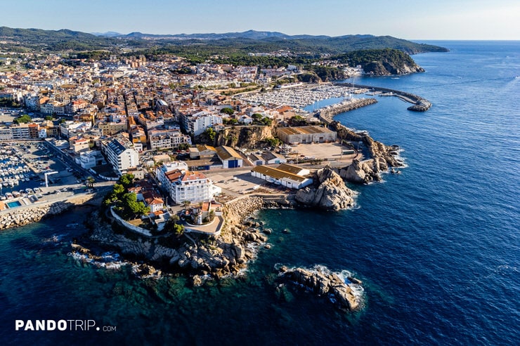 View of the coastal town of Palamós with its marina and old town on the Costa Brava