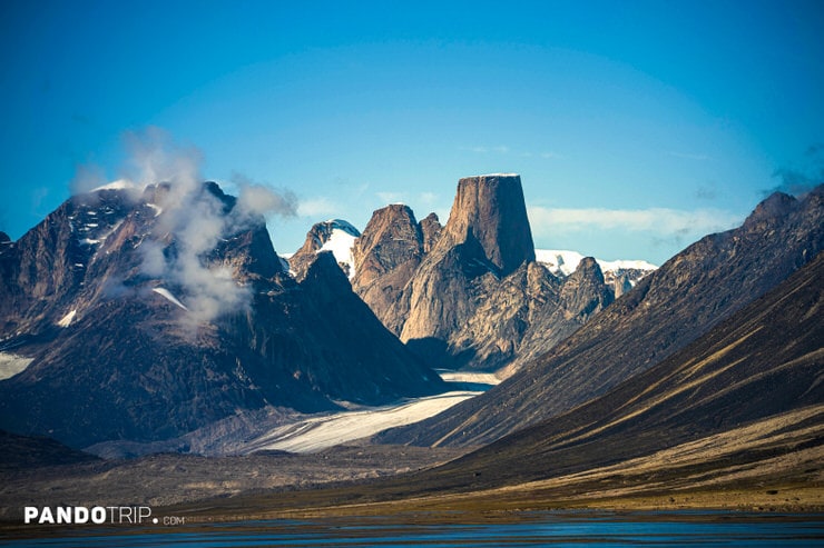 Distant view of Mount Asgard with twin peaks and surrounding glaciers in Canada’s Arctic