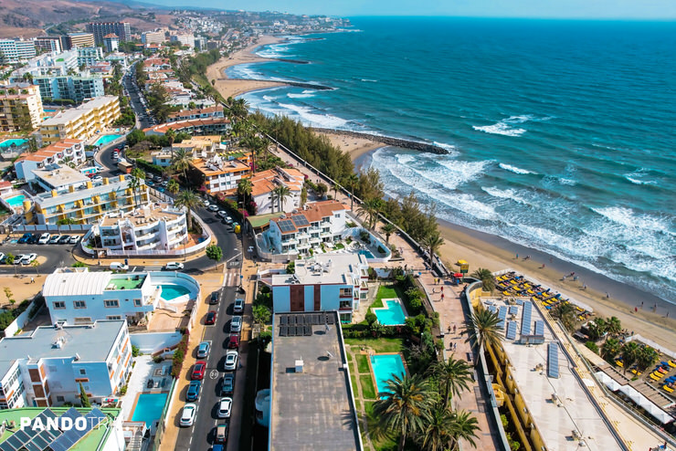 Aerial view of Playa del Inglés with beach, hotels, and Atlantic waves