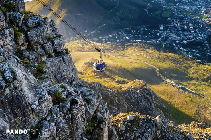 Aerial cable car ascending Table Mountain with panoramic views of Cape Town, South Africa