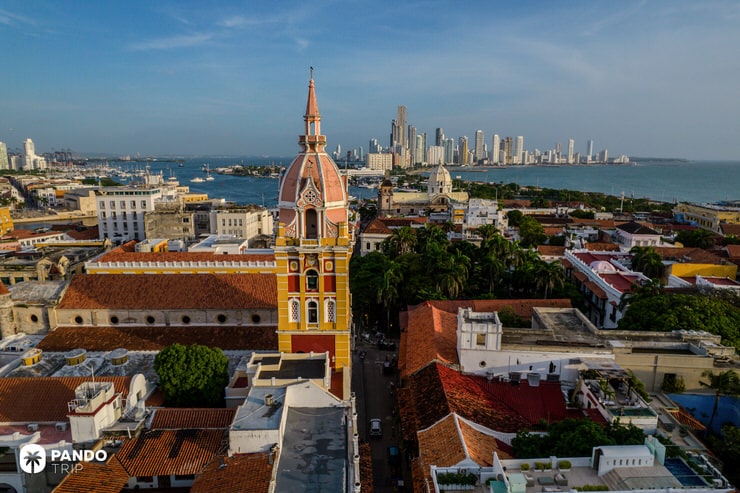 Dome of Cartagena Cathedral rising above the colonial cityscape with the modern skyline in the distance