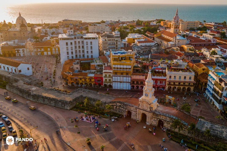 Aerial sunset view of Cartagena’s Clock Tower entrance and historic center by the Caribbean Sea
