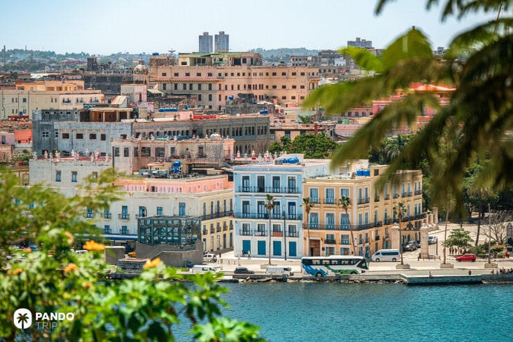 Panoramic view of Old Havana's waterfront with colorful buildings and the Malecón promenade