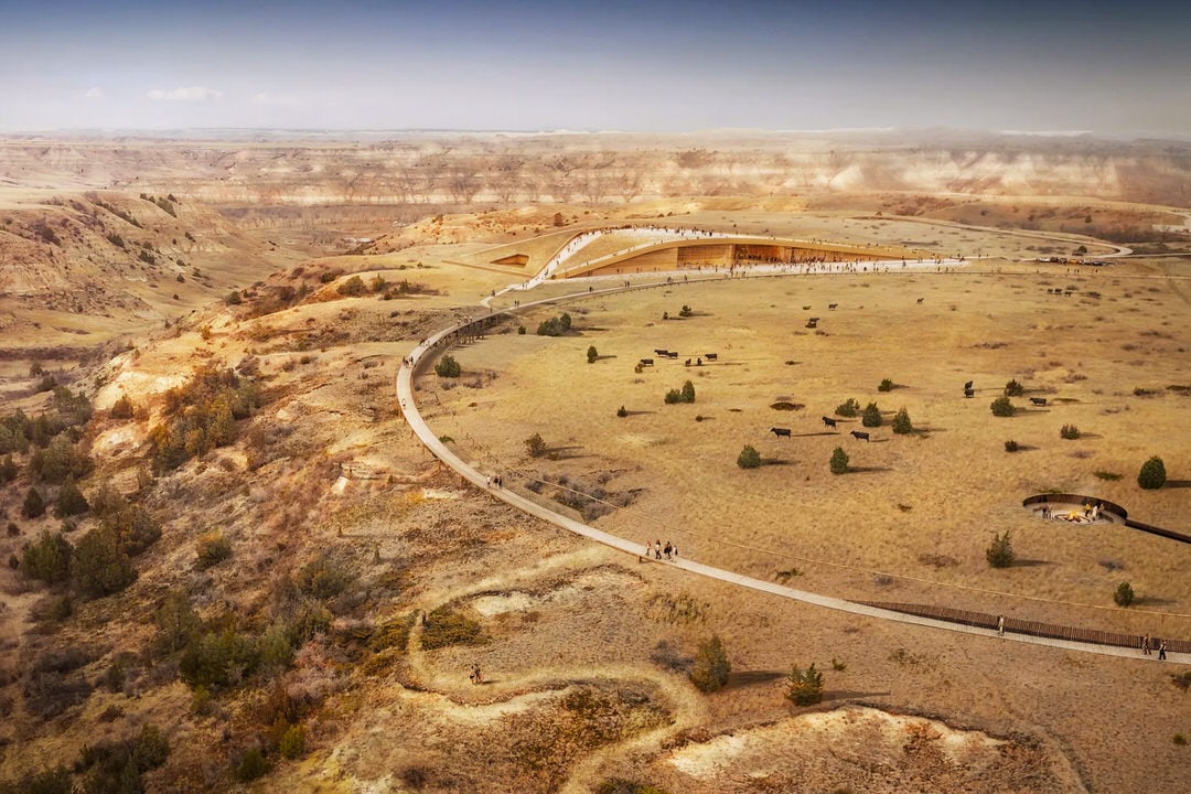 Architectural rendering of the Theodore Roosevelt Presidential Library in North Dakota, with a long curving walkway and grass-covered roof blending into the surrounding badlands landscape.