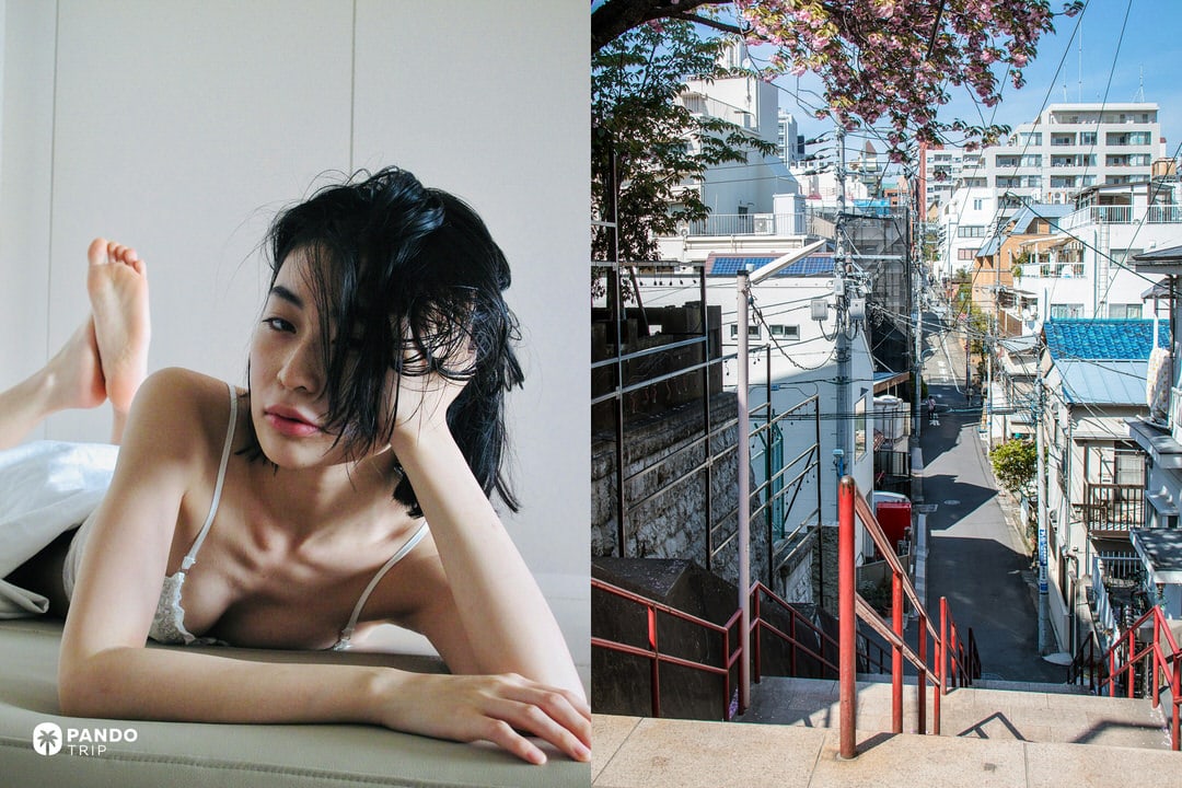 Close-up of a woman wearing a delicate white bra lying on a bed, next to a view of a quiet Tokyo street with stairs.
