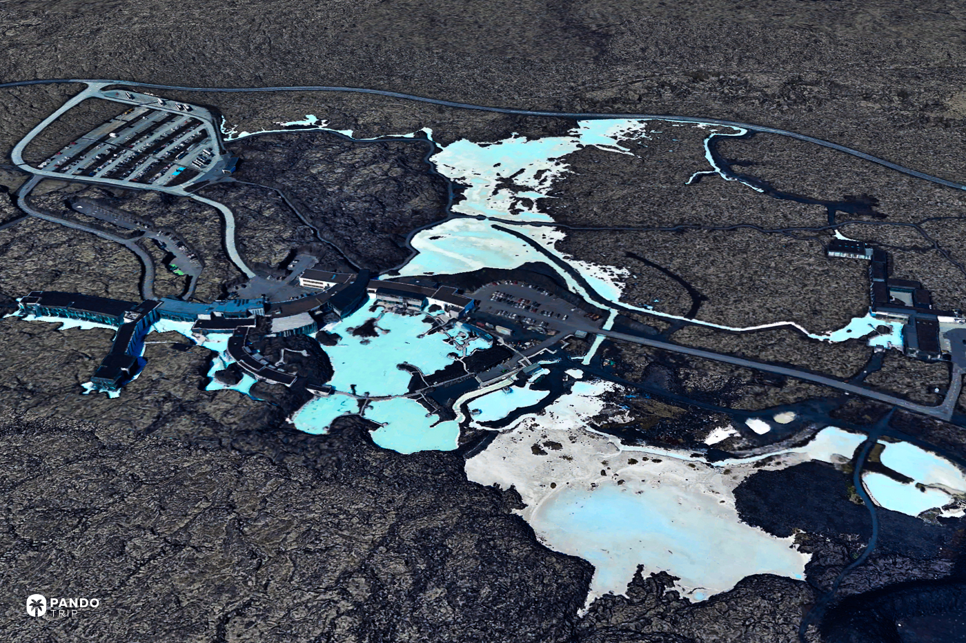 Satellite view of Iceland's Blue Lagoon, its pale pools set in black lava beside the Svartsengi geothermal plant.