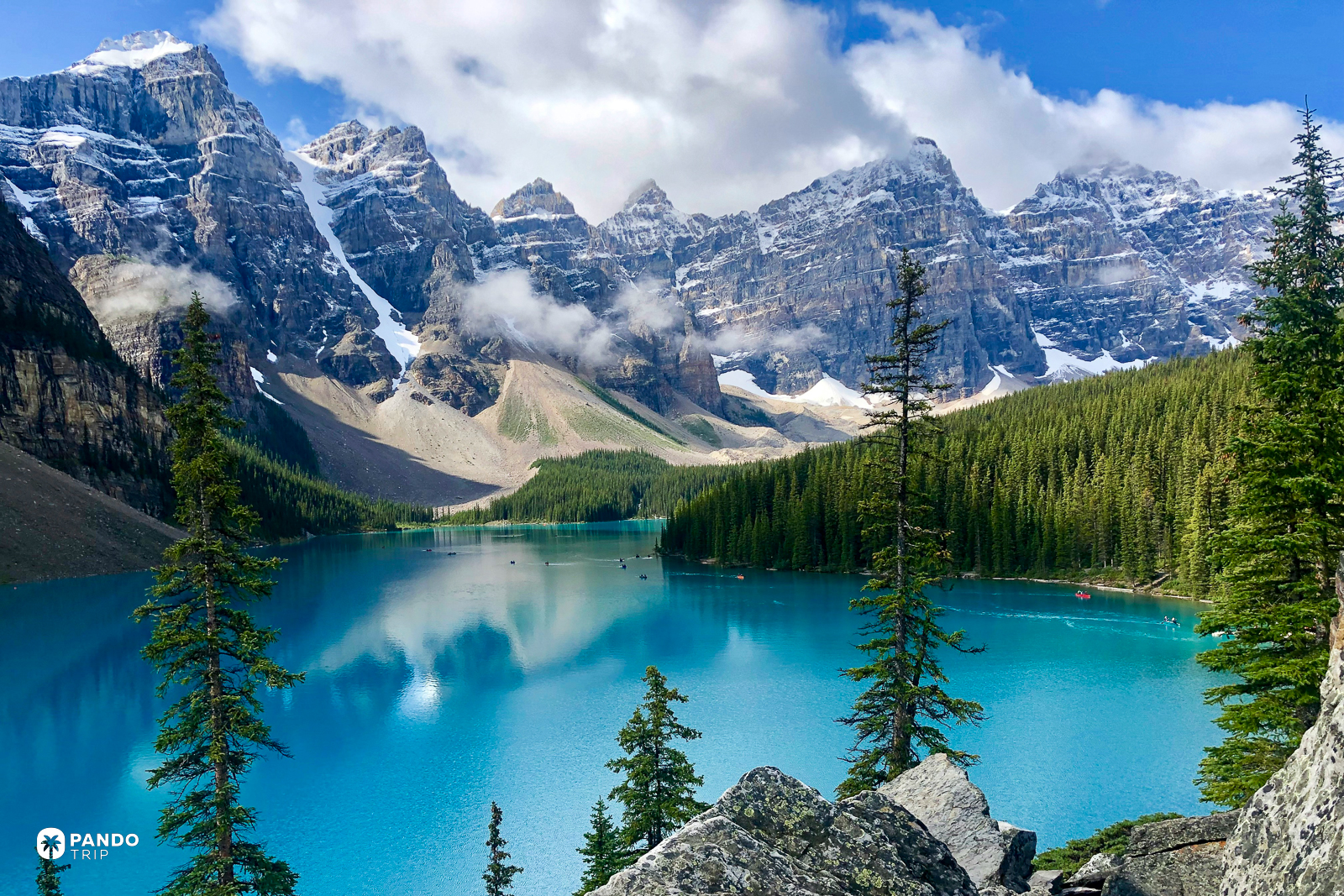 Moraine Lake in Banff, opaque turquoise water below the snow-streaked Valley of the Ten Peaks.