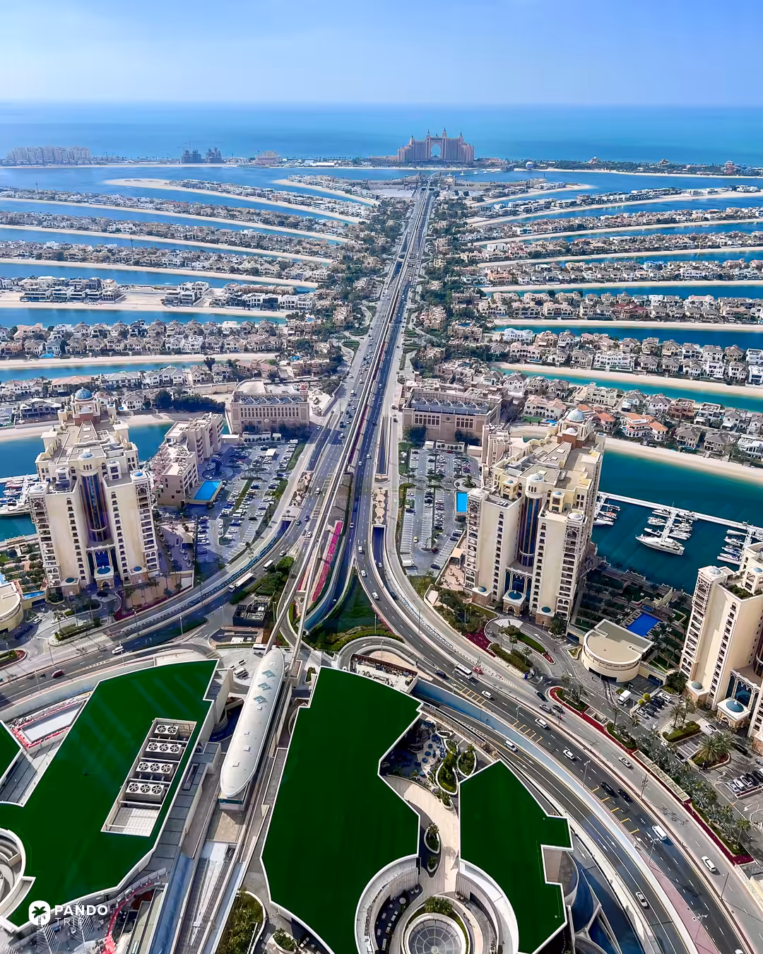 Palm Jumeirah's trunk road and fronds seen from the observation deck at the top of the Palm Tower.