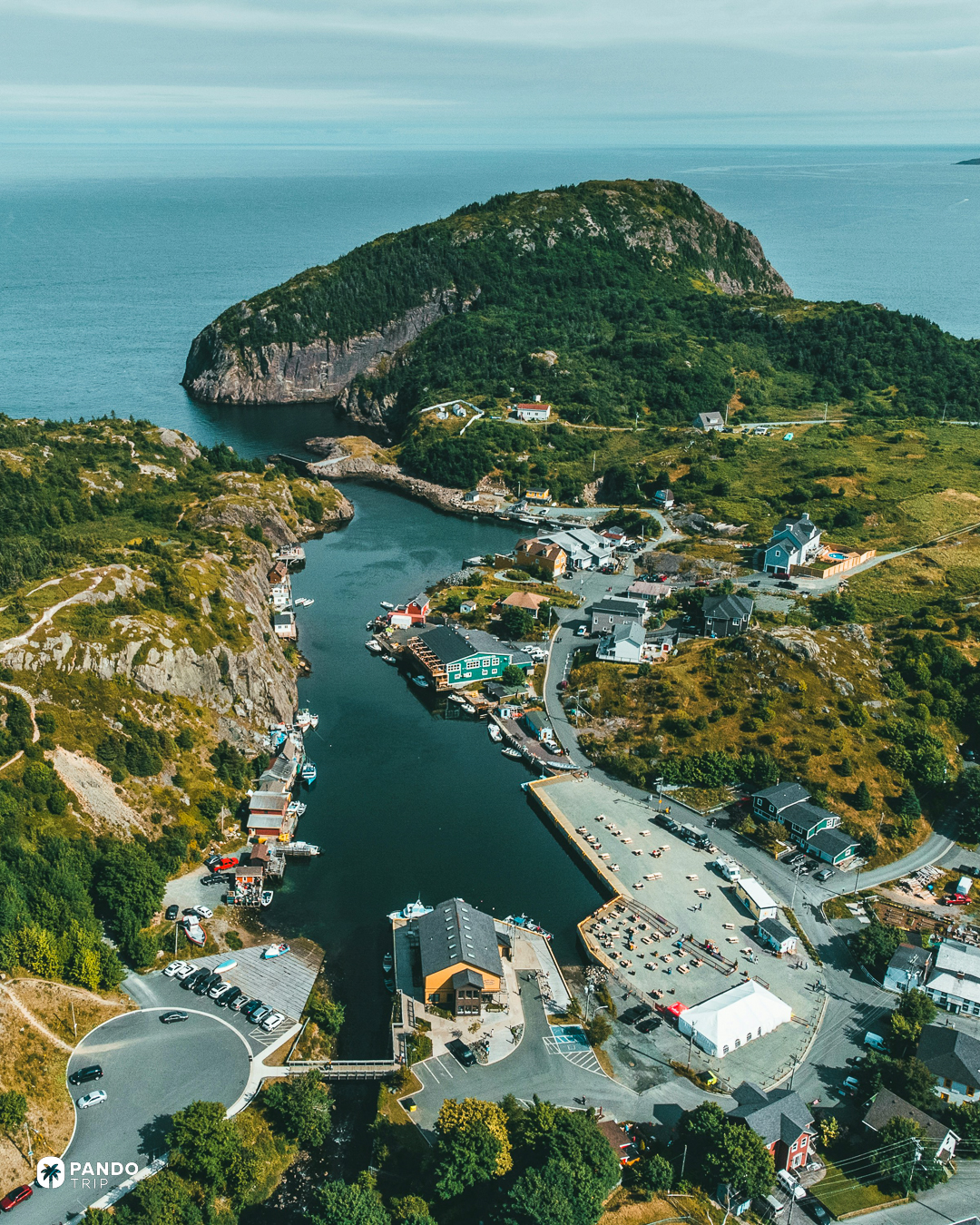 The narrow harbour and fishing sheds of Quidi Vidi with the headland beyond, St John's, Newfoundland.